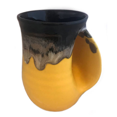 Clay in Motion - The Original Handwarmer Mug: Black Yellow / Right Hand