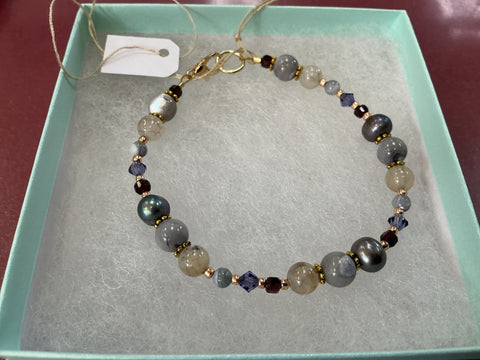 Mauve and purple beads with gold findings  Bracelet by Caitlin