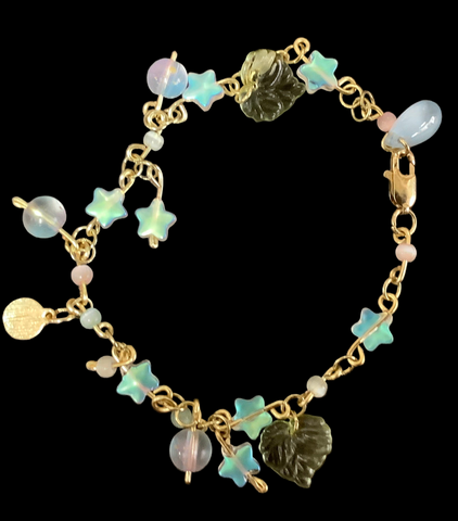 Bows,Leaves,Stars,and Blue Beads on a Bracelet by Rhodesia