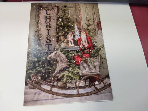 Santa in a horse carriage with greens and christmas bells and  Santa holding a teddy bear blank note cards