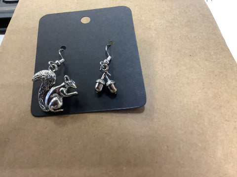 1 earring is a squirrel 1 earring is acorns by artist Jen G.