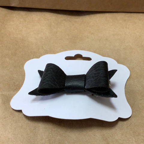Black faux leather bow barrette by local artist Barbie