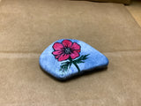 Flowered Rock Hand Painted by Local Artist Cecelia.  Each Rock  is $3.