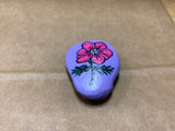 Flowered Rock Hand Painted by Local Artist Cecelia.  Each Rock  is $3.