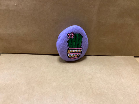 Hand painted rock by local artist Cecelia each rock is $3 each.