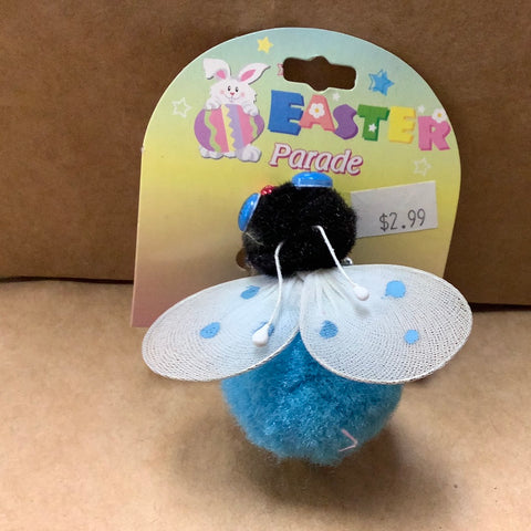 Blue fuzzy butterfly with polka doted wings