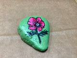 Flowered Rock Hand Painted by Local Artist Cecelia.  Each Rock  is $3.