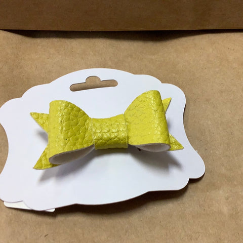 Yellow faux leather bow on barrette by Barbie