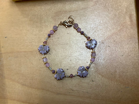 Purple leaf with gold beads by Caitlyn