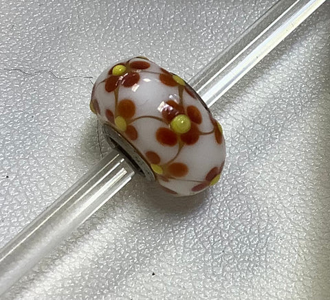 Troll bead white w/ brown flower w/ yellow dot