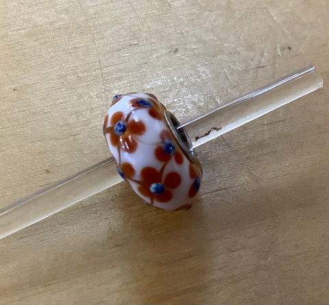 Unique Trollbeads white with brown flowers with raised blue dot