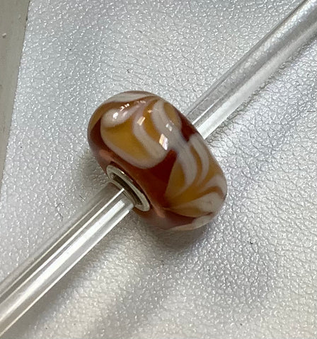 Troll bead amber w/ tan and white