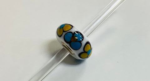 Unique Trollbeads yellow and blue flowers on white