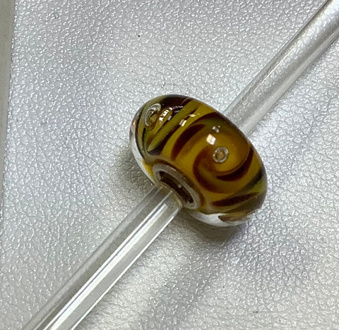 Troll bead yellow w/ brown swirls