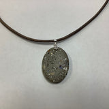 Concrete glow in the dark necklaces by Joe