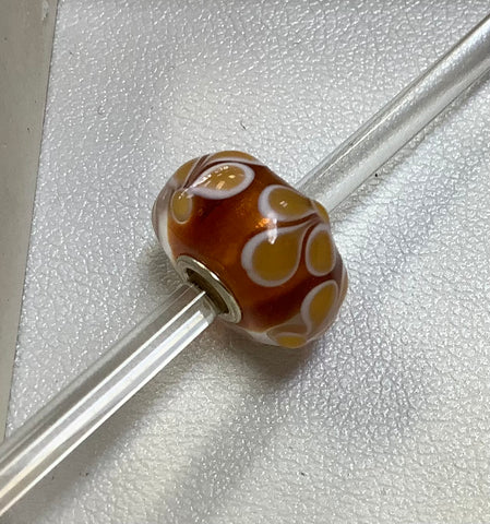 Troll bead amber w/ yellow and white designs