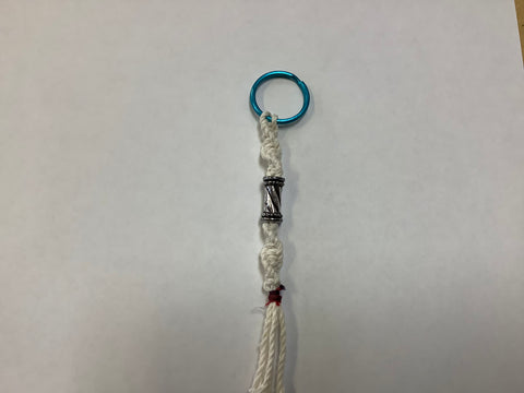White w/ long silver bead keychain by Nancy