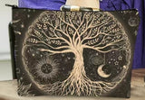 tree of life with sun moon and stars hangiing from branches.