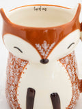 Fox Cup of Cozy Cup by Natural Life.Brown with a small floral design in beige.