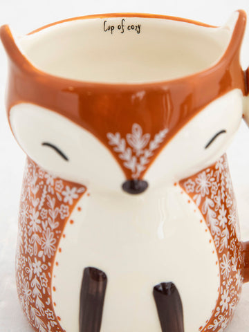 Fox Cup of Cozy Cup by Natural Life.Brown with a small floral design in beige.