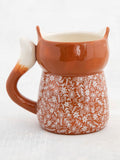 Fox Cup of Cozy Cup by Natural Life.Brown with a small floral design in beige.